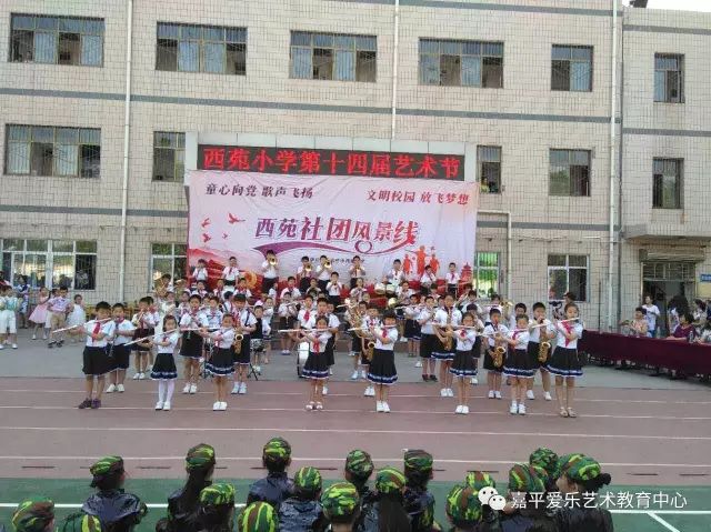 嘉平爱乐教师交响管乐团亲情助阵石家庄市各小学六一文化艺术节